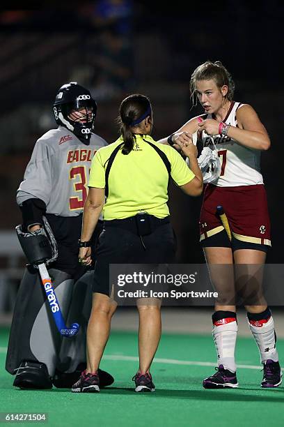 Referee Lynn Carrino talks to Boston College's Audra Hampsch and Frederique Haverhals . The Duke University Blue Devils hosted the Boston College...