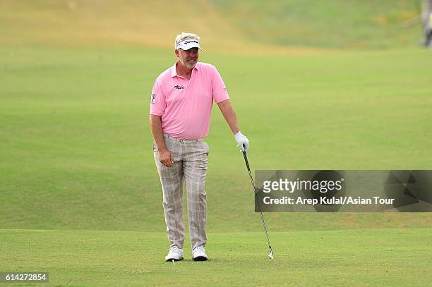 Darren Clarke of Northern Ireland plays a shot during round one of the 2016 Venetian Macao Open at Macau Golf and Country Club on October 13, 2016 in...