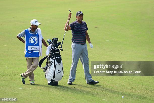 Arjun Atwal of India plays a shot during round one of the 2016 Venetian Macao Open at Macau Golf and Country Club on October 13, 2016 in Macau, Macau.