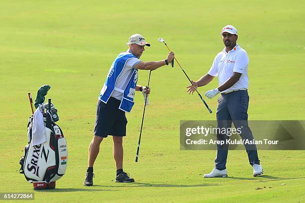 Anirban Lahiri of India plays a shot during round one of the 2016 Venetian Macao Open at Macau Golf and Country Club on October 13, 2016 in Macau,...