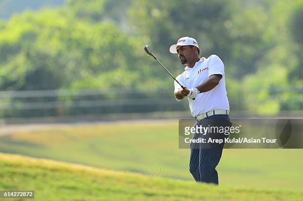 Anirban Lahiri of India plays a shot during round one of the 2016 Venetian Macao Open at Macau Golf and Country Club on October 13, 2016 in Macau,...