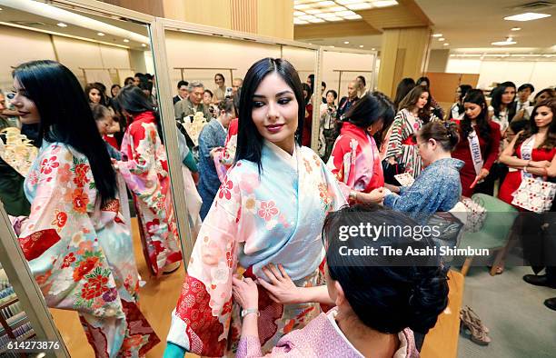 Entrants in the Miss International Beauty Pageant 2016 try on kimono at the Mitsukoshi department store on October 12, 2016 in Tokyo, Japan....