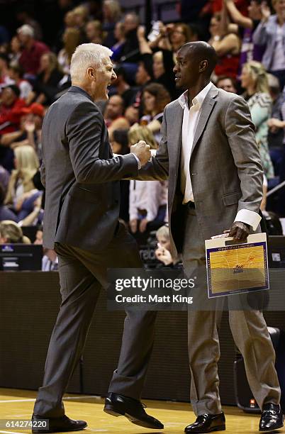 Kings coach Andrew Gaze and assistant coach Lanard Copeland celebrate victory during the round two NBL match between the Illawarra Hawks and the...