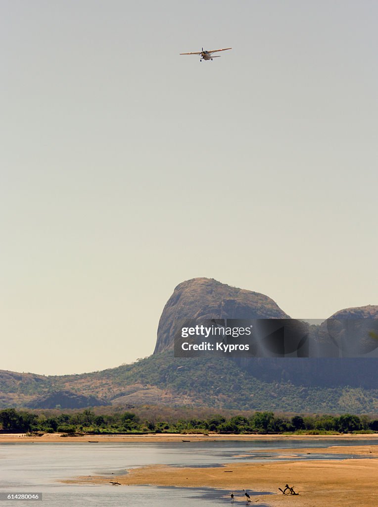 Africa, Southern Africa, Mozambique, View Of Private Aircraft Landing In Jungle