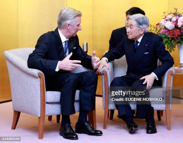 Belgian King Philippe talks to Japanese Emperor Akihito after a concert at Kioi Hall in Tokyo, on October 13, 2016. The Belgian royal couple is on a...