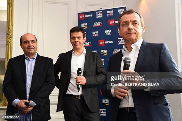 President of the NextRadioTV group and CEO of SFR group in charge of Media activities Alain Weill stands next to BFM TV's editorial director Herve...