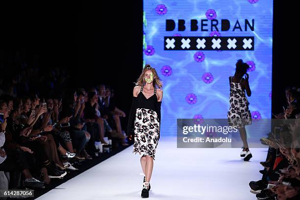 Model walks on the stage as she presents the designer Deniz Berdan's collection during the Mercedes-Benz Fashion Week Spring/Summer 2017 at the Zorlu...