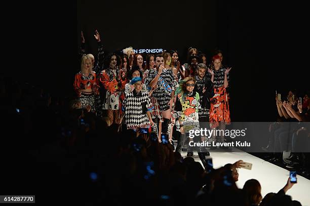 Designers, Deniz Berdan , Begum Berdan and modelds are applauded walks the runway at the DB Berdan show during Mercedes-Benz Fashion Week Istanbul at...