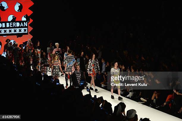 Gonca Vuslateri , Ruzgar Erkoclar and models walk the runway at the DB Berdan show during Mercedes-Benz Fashion Week Istanbul at Zorlu Center on...
