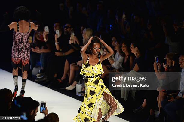 Models walk the runway at the DB Berdan show during Mercedes-Benz Fashion Week Istanbul at Zorlu Center on October 13, 2016 in Istanbul, Turkey.