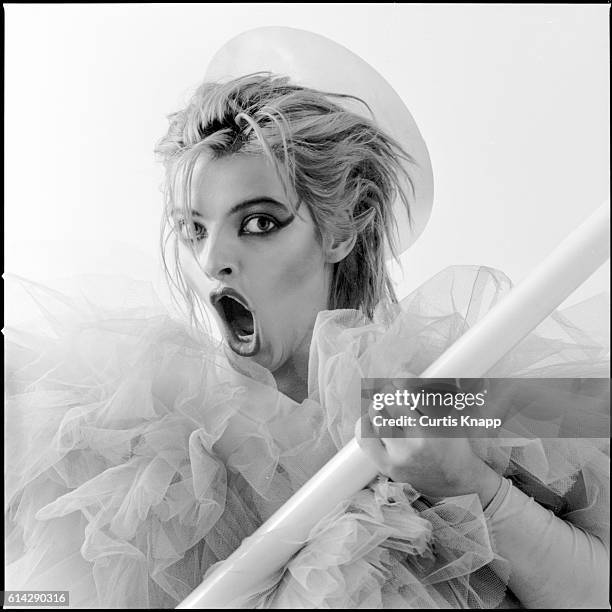 Portrait of German musician Nina Hagen as she poses, open-nouthed, wrapped in chiffon, New York, 1980s.