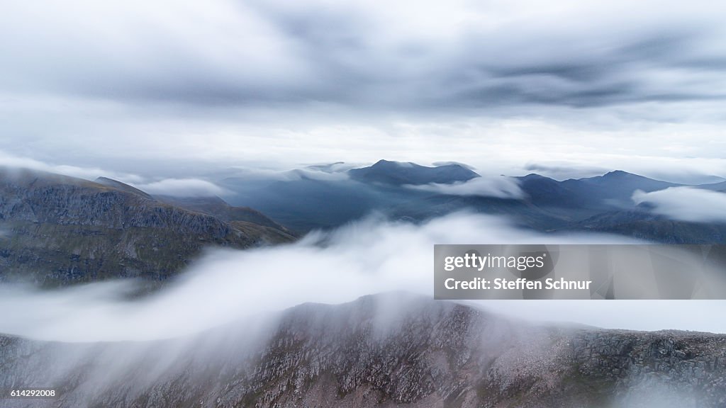 Above the clouds over the clouds betweem the clouds mountain