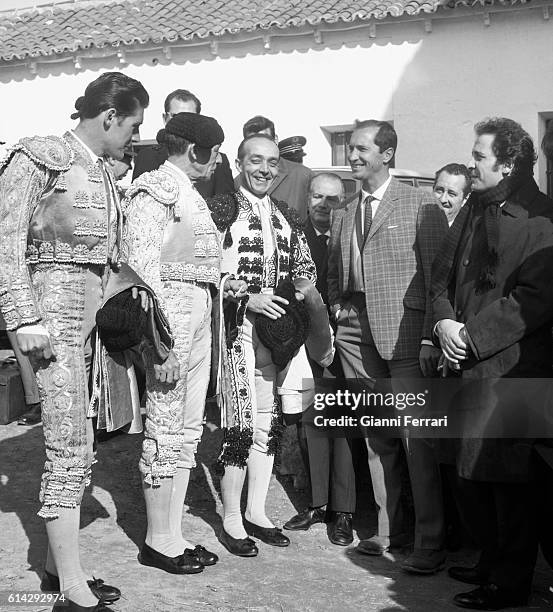 The Italian singer Domenico Modugno with Spanish bullfighter Luis Miguel Dominguín , spectators of a bullfight Madrid, Spain. .