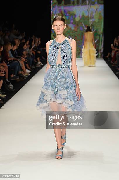 Model walks the runway at the Bora Aksu show during Mercedes-Benz Fashion Week Istanbul at Zorlu Center on October 13, 2016 in Istanbul, Turkey.