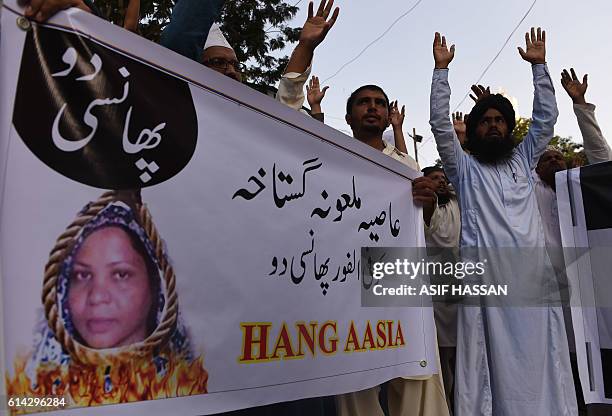 Pakistani protesters shout slogans against Asia Bibi, a Christian woman facing death sentence for blasphemy, at a protest in Karachi on October 13,...