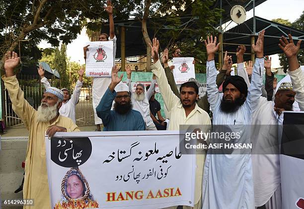 Pakistani protesters shout slogans against Asia Bibi, a Christian woman facing death sentence for blasphemy, at a protest in Karachi on October 13,...