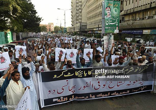 Pakistani protesters shout slogans against Asia Bibi, a Christian woman facing death sentence for blasphemy, at a protest in Karachi on October 13,...