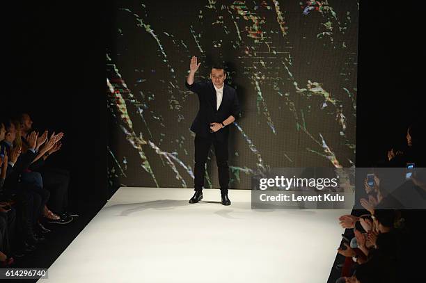 Designer Bora Aksu walks the runway at the Bora Aksu show during Mercedes-Benz Fashion Week Istanbul at Zorlu Center on October 13, 2016 in Istanbul,...