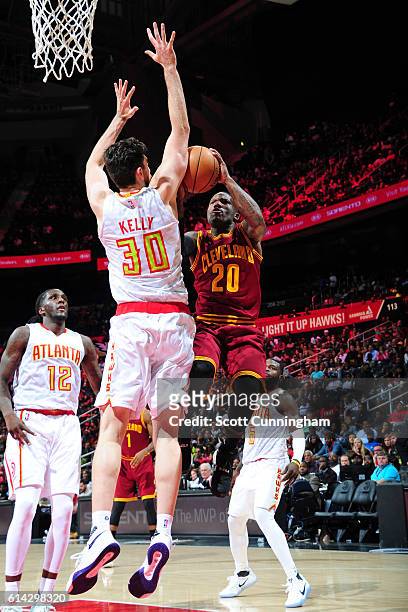 Kay Felder of the Cleveland Cavaliers shoots the ball against Ryan Kelly of the Atlanta Hawks on October 10, 2016 at Philips Arena in Atlanta,...