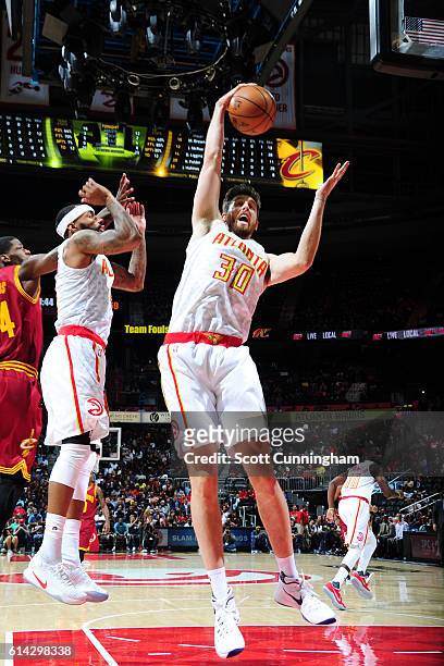 Ryan Kelly of the Atlanta Hawks rebounds the ball against the Cleveland Cavaliers on October 10, 2016 at Philips Arena in Atlanta, Georgia. NOTE TO...