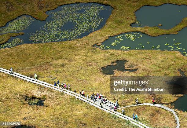 In this aerial image, people enjoy trekking in the Ozegahara on October 2, 2016 in Katashina, Gunma, Japan.