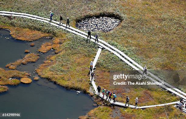 In this aerial image, people enjoy trekking in the Ozegahara on October 2, 2016 in Katashina, Gunma, Japan.