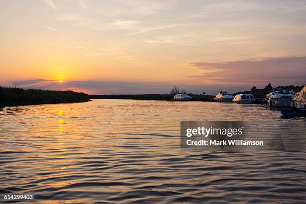 sunset in the norfolk broads. - norfolk broads stock pictures, royalty-free photos & images