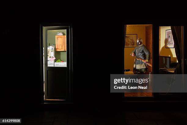 Matthijs Demedts of the st Centingas historic re-enactment group poses for portraits in his home while wearing his replica Norman clothing on October...