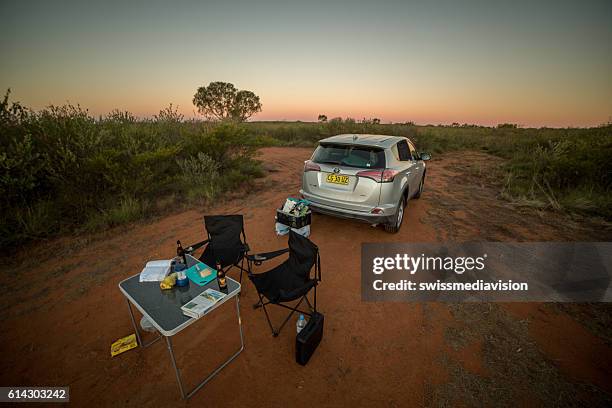 camp set in the australian outback at dusk - fun northern territory stock pictures, royalty-free photos & images