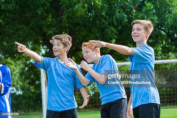 boys soccer team object to referee's call - penalty kick stock pictures, royalty-free photos & images