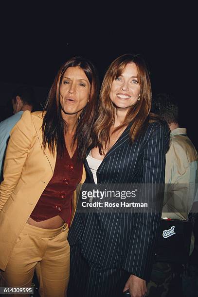 American fashion models Janice Dickinson and Carol Alt at the Tommy Hilfiger Men's and Women's Spring 2003 fashion show, New York City, 18th...