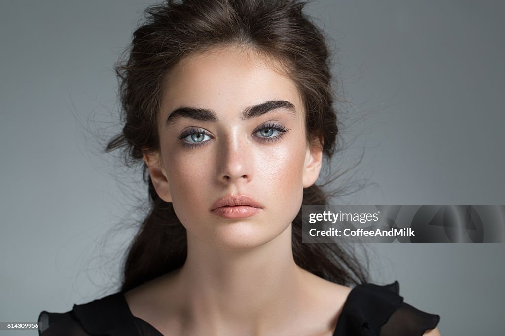 Studio shot of young beautiful woman