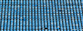 Empty rows of blue stadium seats