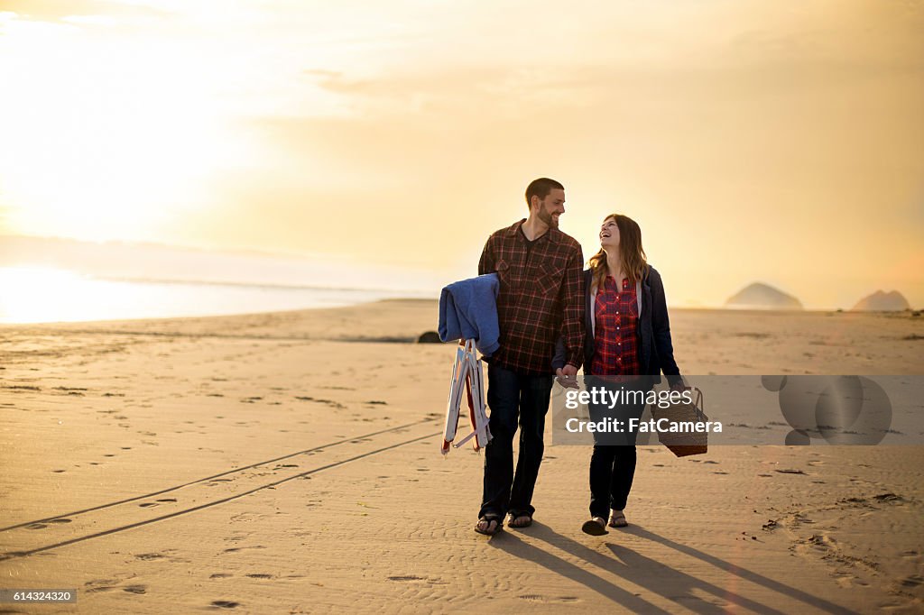 Attractive couple having a picnic and taking a walk