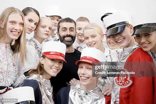 Fashion Designer Giambattista Valli poses with the models during the Moncler Gamme Rouge show as part of the Paris Fashion Week Womenswear...