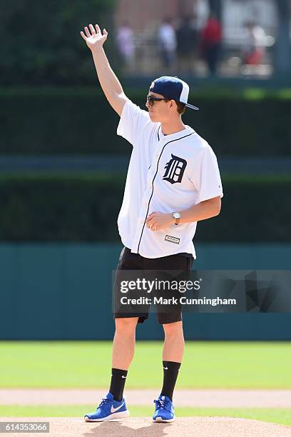 Olympic silver medalist swimmer Connor Jaeger waves to the crowd before throwing out the ceremonial first pitch prior to the game between the Detroit...