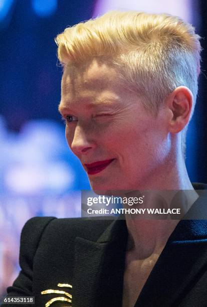 British actress Tilda Swinton winks as she attends a red carpet event to promote her latest movie, Marvel's "Doctor Strange", in Hong Kong on October...