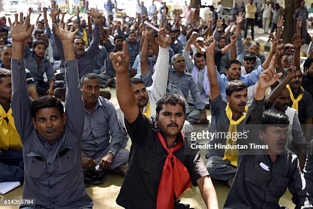 Drivers of green auto and black-yellow taxis shouting slogans during their rally at Jantar Mantar on October 13, 2016 in New Delhi, India. Three...