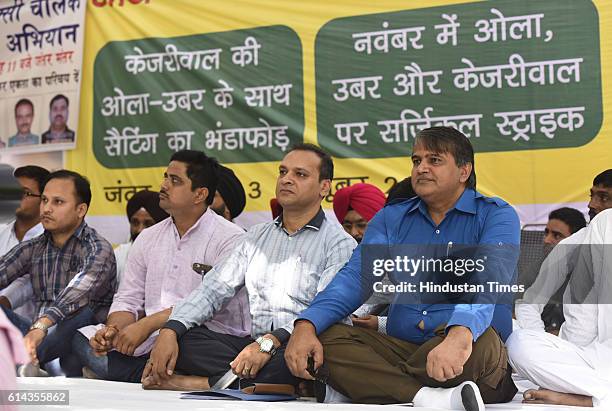 Rebel AAP MLA Col. Devinder Sehrawat and other Naya Bhumi members during the rally of auto and kaali-peeli taxi drivers at Jantar Mantar on October...
