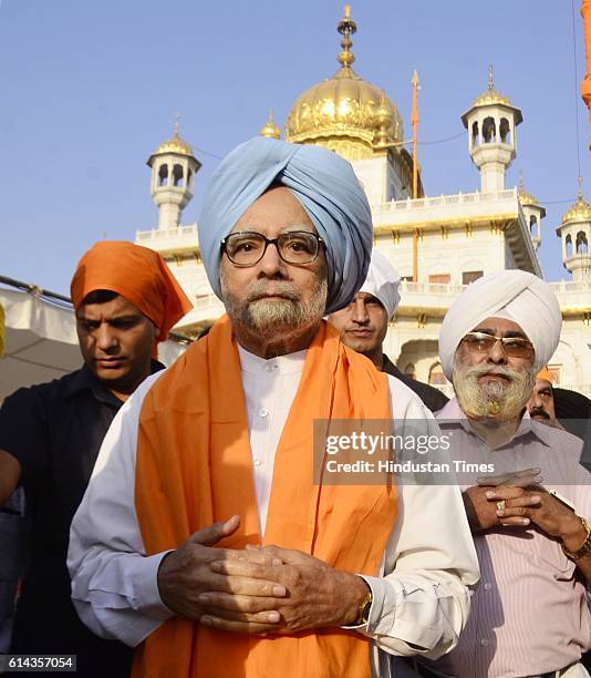 Former Indian Prime Minister Manmohan Singh along with his brother Surjit Singh Kohli paying obeisance at Golden Temple during his visit on October...