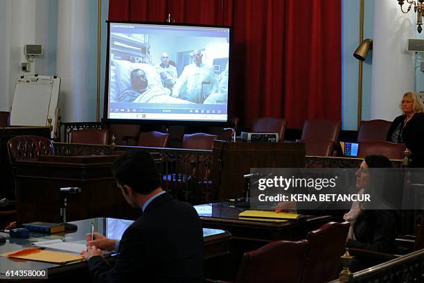 Suspected bomber Ahmad Khan Rahami attends the first court hearing on screen in Elizabeth, New Jersey while he remains in University Hospital in...