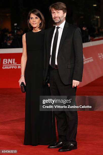 Dario Franceschini and Michela Di Biase walk a red carpet for 'Moonlight' on October 13, 2016 in Rome, Italy.