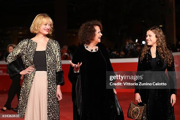 Lea Mornar, Claudia Cardinale and Francesca Cardinale walk a red carpet for 'Moonlight' on October 13, 2016 in Rome, Italy.