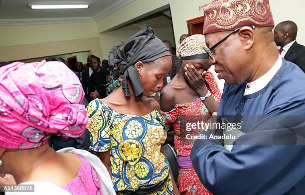 Nigeria's Vice President Yemi Osinbajo and Nigeria's Minister of Information and Culture Alhaji Lai Mohammed welcome some of the freed Chibok school...