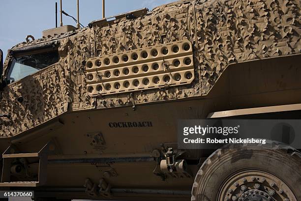 Convoy of British Army Mine Resistant Ambush Protected, or MRAPs, known as Foxhounds, works it's way through morning traffic jams in downtown Kabul...