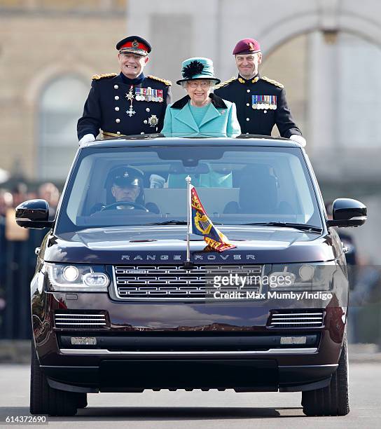 Queen Elizabeth II, Colonel-in-Chief of the Corps of Royal Engineers, accompanied by Lieutenant General Sir Mark Mans and Lieutenant Colonel Sean...
