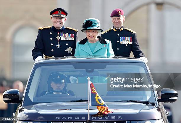 Queen Elizabeth II, Colonel-in-Chief of the Corps of Royal Engineers, accompanied by Lieutenant General Sir Mark Mans and Lieutenant Colonel Sean...