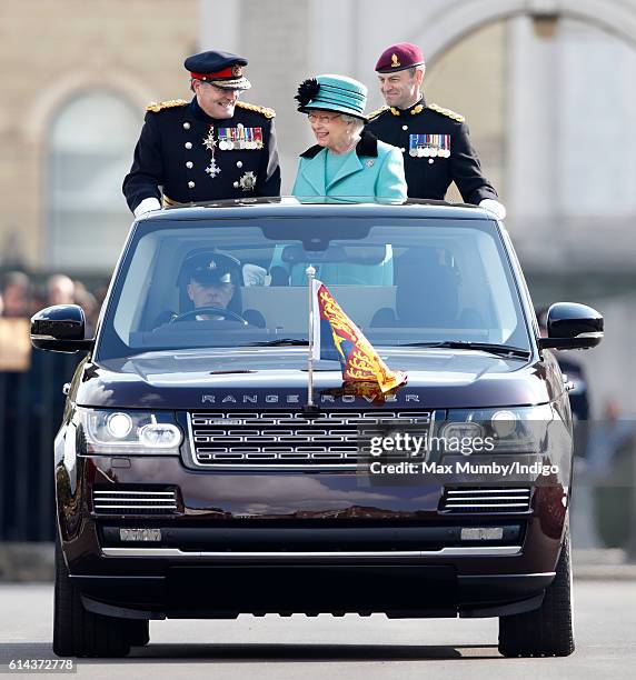 Queen Elizabeth II, Colonel-in-Chief of the Corps of Royal Engineers, accompanied by Lieutenant General Sir Mark Mans and Lieutenant Colonel Sean...