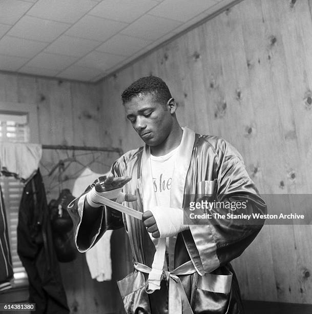 Floyd Patterson wraps his hands before training on May 12, 1956 at Greenwood Lake, New York.