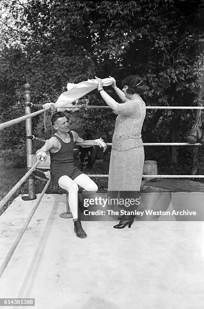 Eugene Criqui, French battle scarred war hero and contender for the worlds featherweight championship is training hard for his match against Johnny...